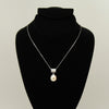 Freshwater pearl pendant head over heals - Silver chain