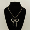 Synthetic diamond bow pendant necklace