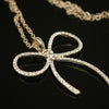 Synthetic diamond bow pendant necklace